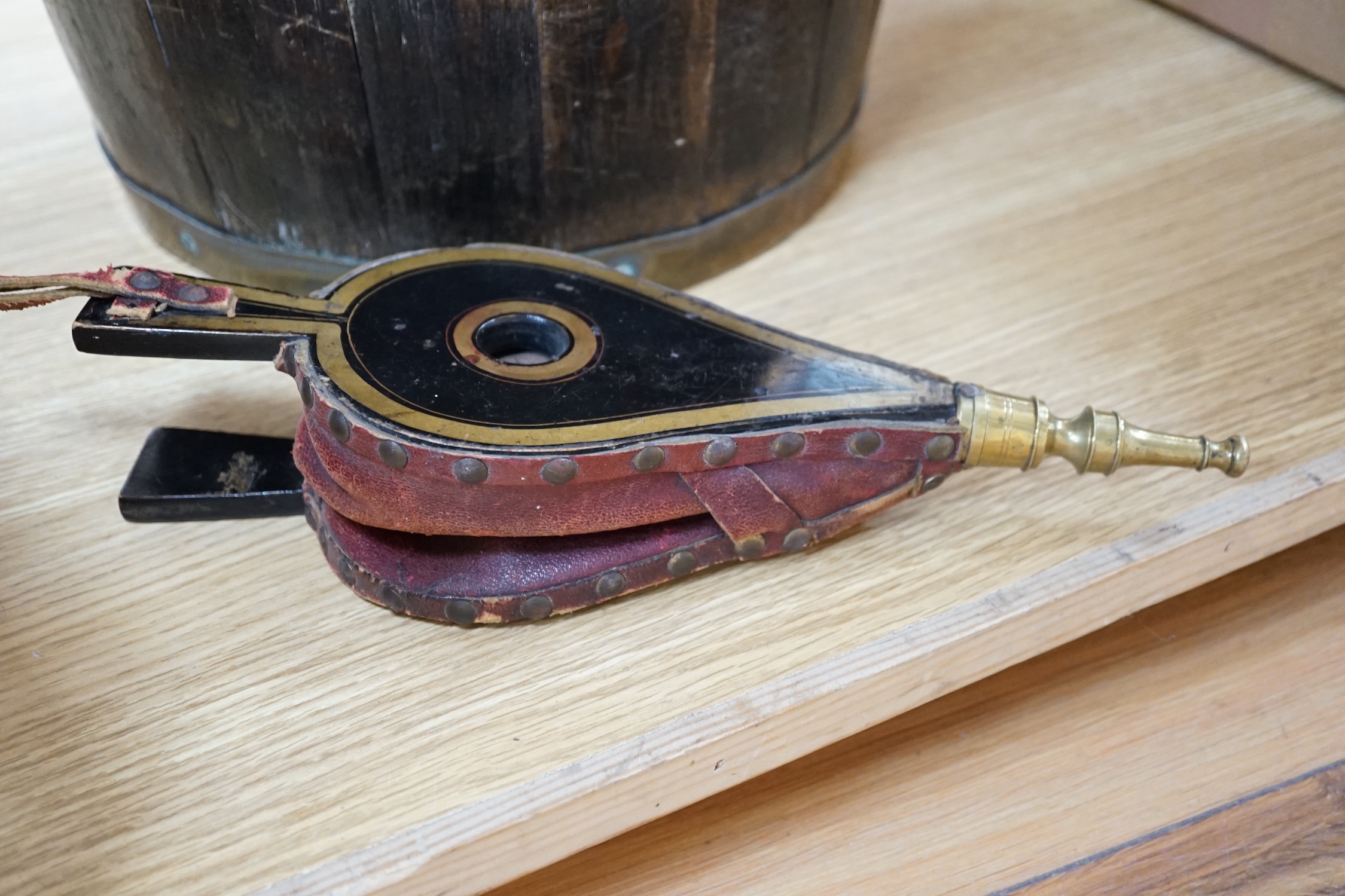 A coopered brass bound oak bucket, 24.5cm and a small pair of lacquered bellows